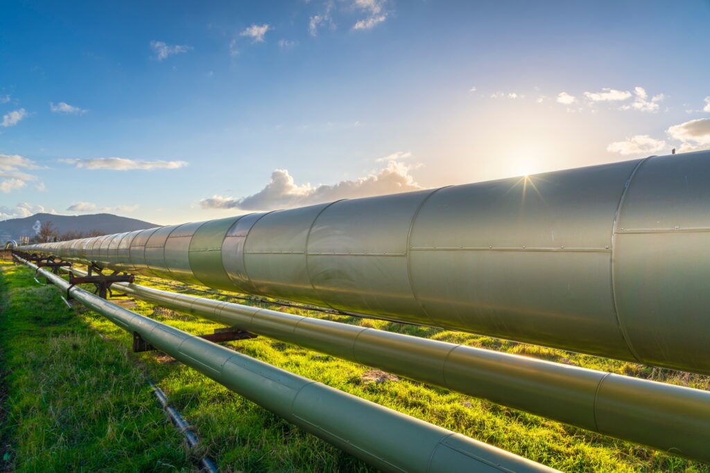 geothermal energy pipelines of a plant at sunset in larderello tuscany region italy